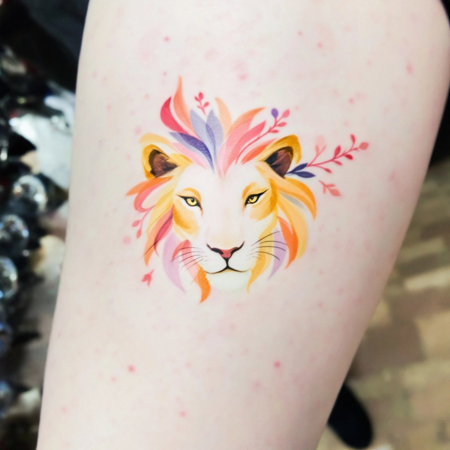 lion-and-cub-tattoo-emphasizing-family-bonds-with-a-natural-setting.jpg